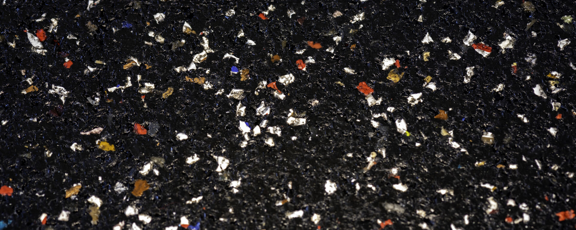 Close-up of Nike Grind rubber compound texture showing distinctive speckled finish